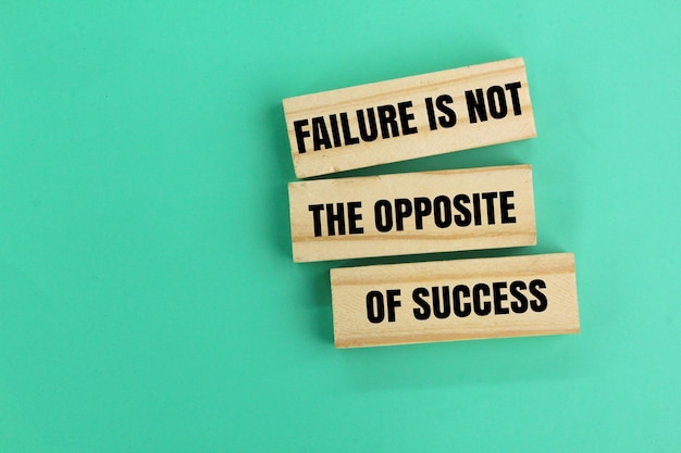 wood and quotes the word Failure is not the opposite of success the concept of inspiration