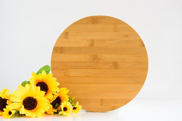 Wood round sign rustic mockup with bouquet of sunflowers on white background