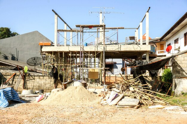 Wood stone sand with construction equipment at home construction site