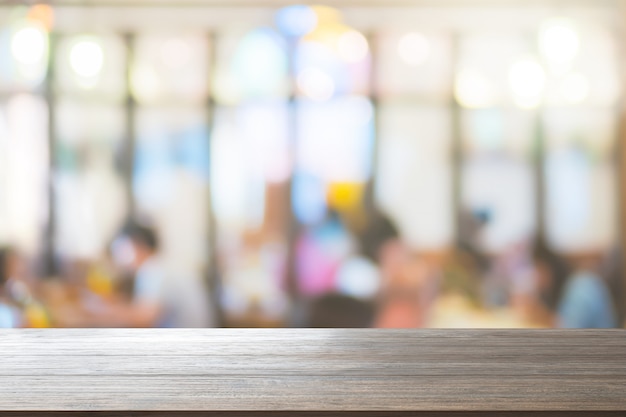 Wood Table Top Background on blur customer at restaurant or cafe coffee shop for montage p