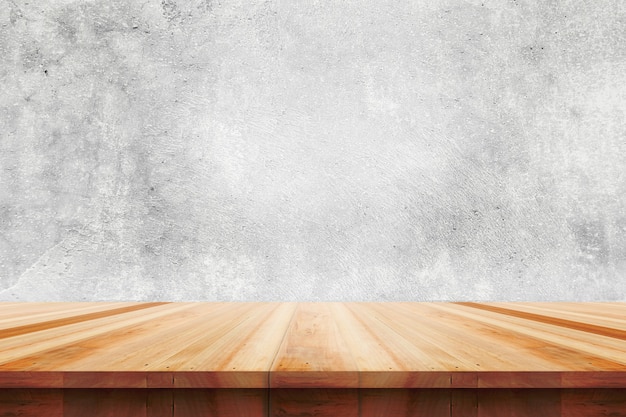 Wood table top on bare concrete wall background - can be used for display or montage your products.