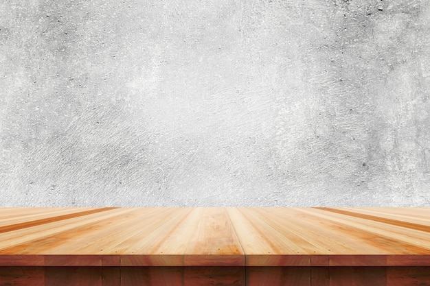 Wood table top on bare concrete wall background - can be used for display or montage your products