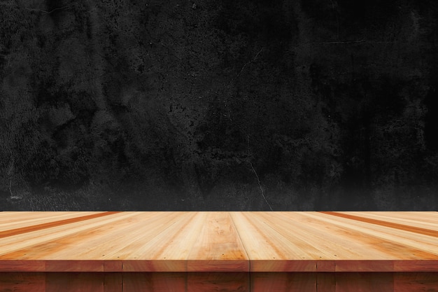 Wood table top on bare concrete wall background - can be used for display or montage your products.