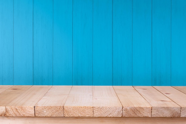 Wood table top on blue wood background