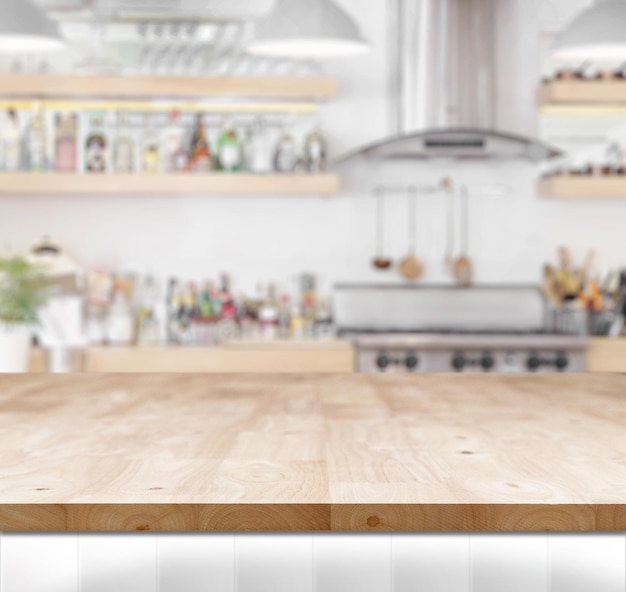 Wood table top on blur kitchen background