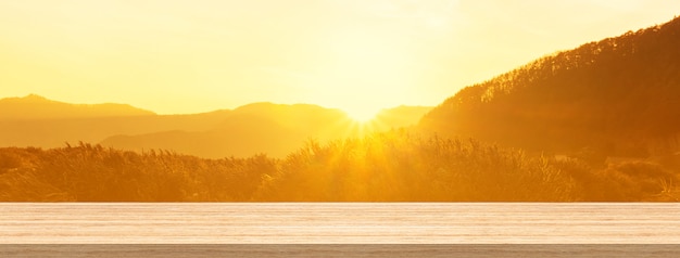 Wood table top and blur sunrise or sunset background for product 