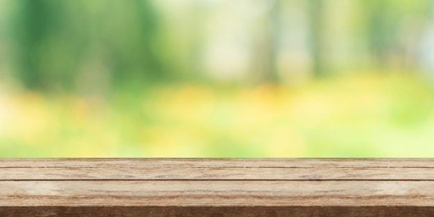 Wood table top in front of natural blur bokeh background and copy space. display or montage products 