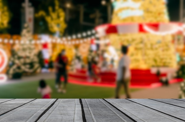 Wood table top product empty counter abstract blur background person bokeh light festive decoration display vintage retro tone