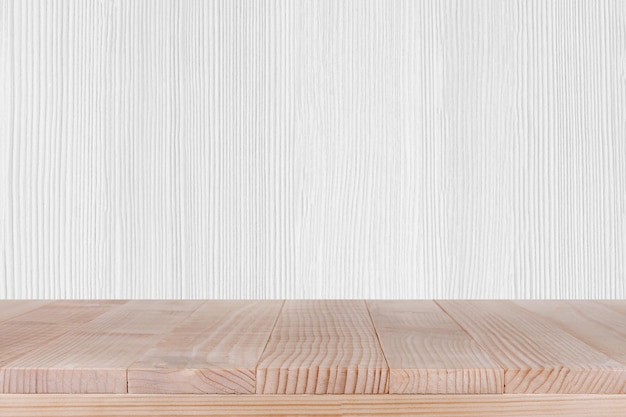 Wood table top on white wood background can be used for montage or display your products