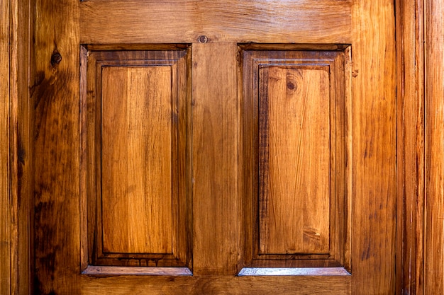 Wood texture of a carved varnished door Pattern concept