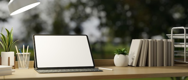 Wood workspace tabletop with portable tablet mockup accessories and decor plants