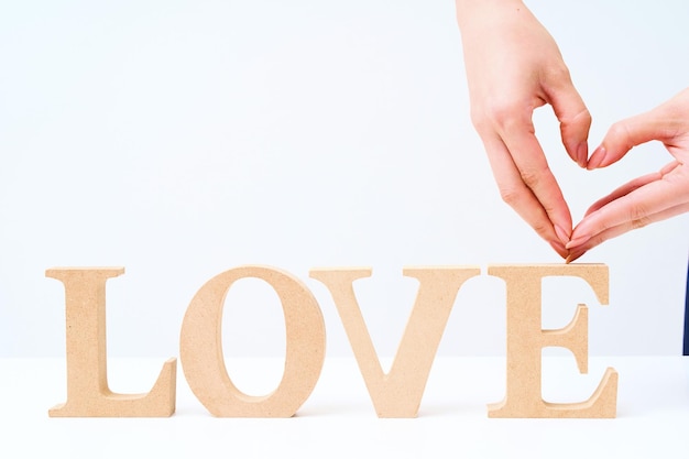 Photo wooden alphabet blocks arranged to spell out love