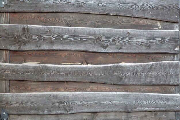 Wooden background from gray and brown boards. Wood texture.