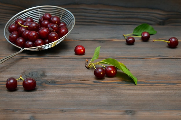 Wooden background with cherries and place for object