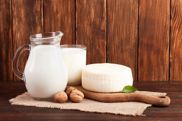 Wooden background with dairy products