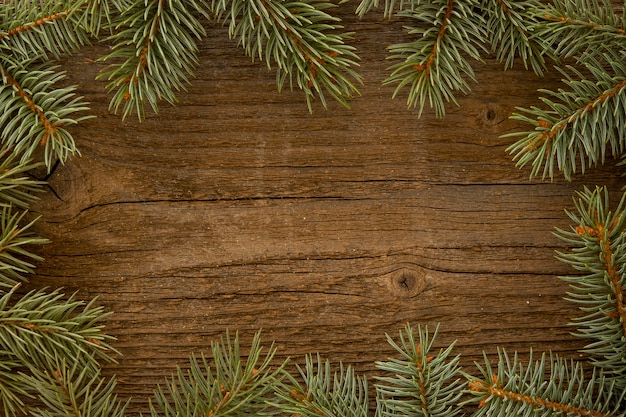 Wooden background with pine needles