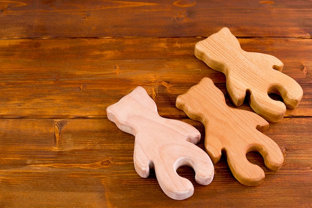 Wooden background  wooden bears on a wooden surface