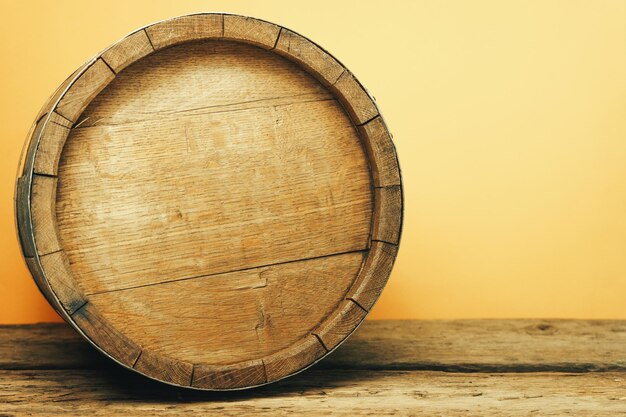 Wooden barrel and worn old table of wood