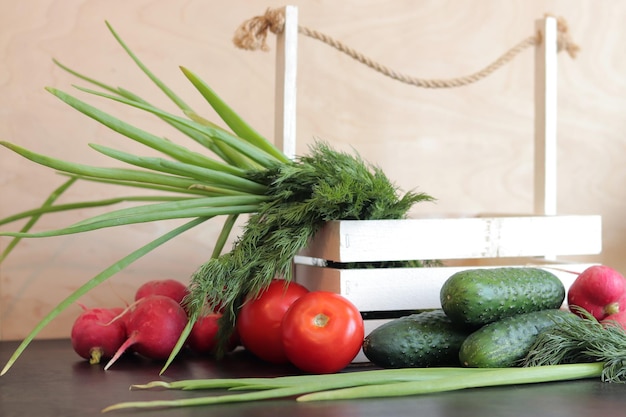 Wooden basket with fresh vegetables