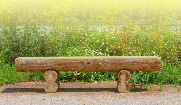 Photo wooden bench in the garden on soft sunlight