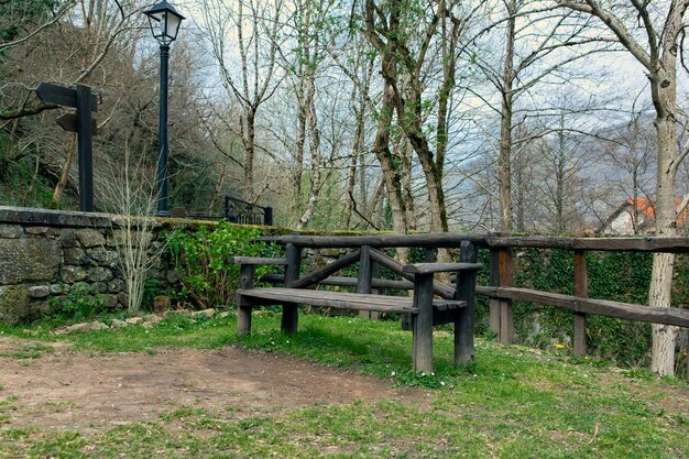 Wooden bench located in natural setting