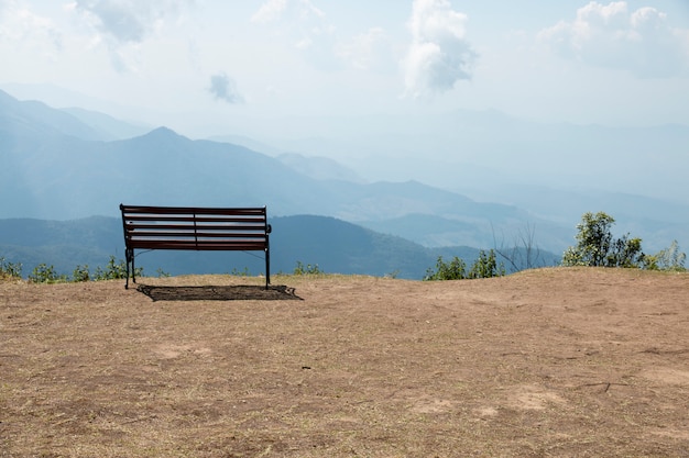 Wooden bench outdoor landscape with mountains view.