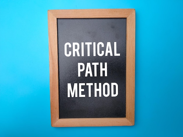 Wooden black board with the word CRITICAL PATH METHOD