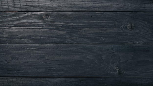 Wooden black texture background Top view Free space for your text