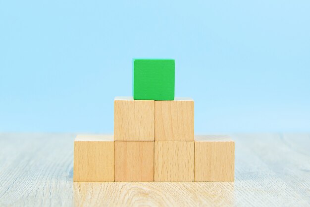 Photo wooden block toy stacked in pyramid shape