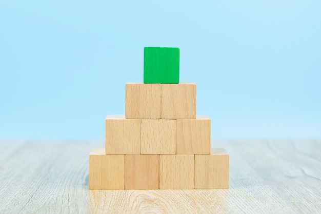 Photo wooden block toy stacked in pyramid shape