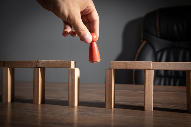 Wooden blocks for a human figure to walk across Solving problems