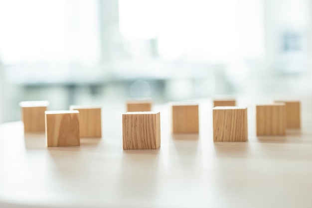 Wooden blocks randomly placed on office desk