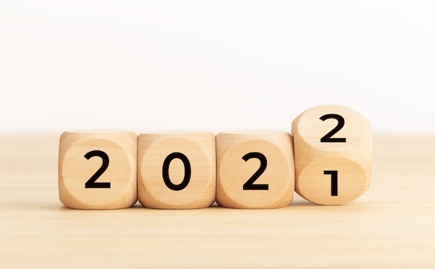 Wooden Blocks With changing number 2021 2022. New year concept. Copy space. White background