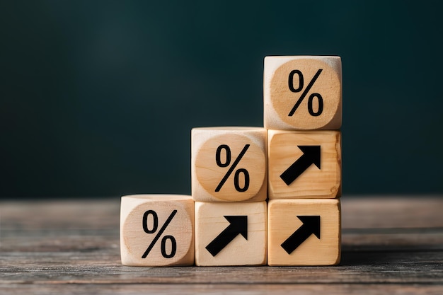 Wooden blocks with percentage icon arrow pointing up financial concept