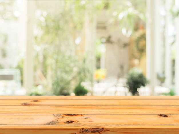 Wooden board empty table top on of blurred background