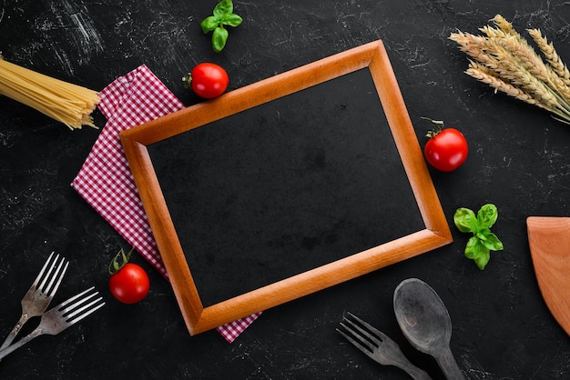 Wooden board for notes with vegetables Menu On the old background Top view Free copy space