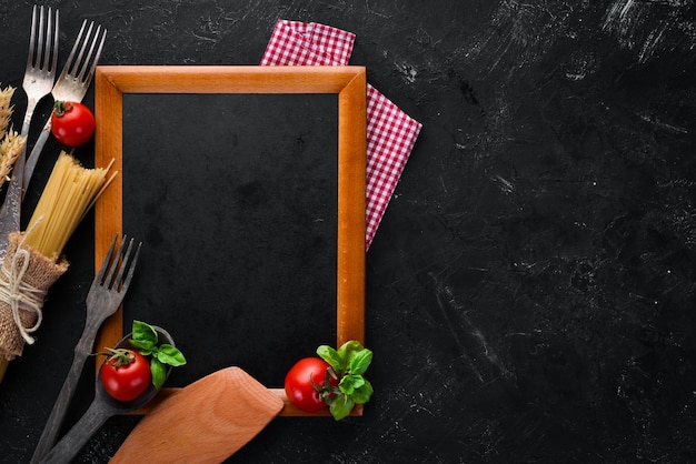 Wooden board for notes with vegetables Menu On the old background Top view Free copy space