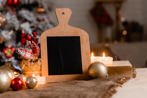 A wooden board with a christmas tree in the background