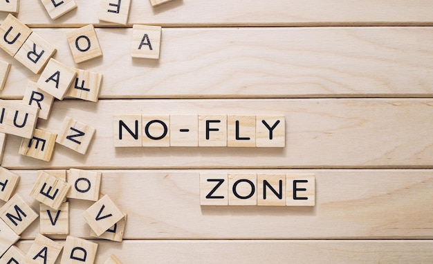 A wooden board with a jumble of letters