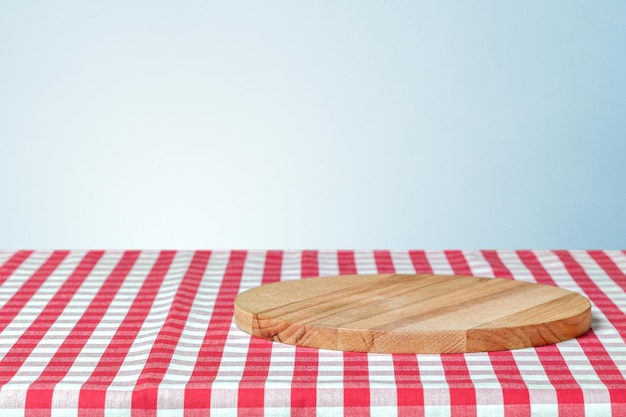 Wooden board with a napkin on a table