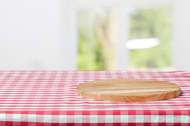 Wooden board with a napkin on a table