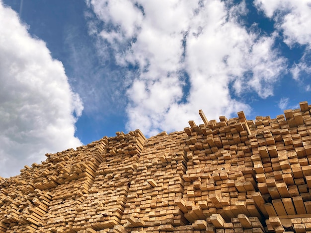 Wooden boards lumber industrial wood timber Pine wood timber stack of natural rough wooden boards on building site Industrial timber building materials