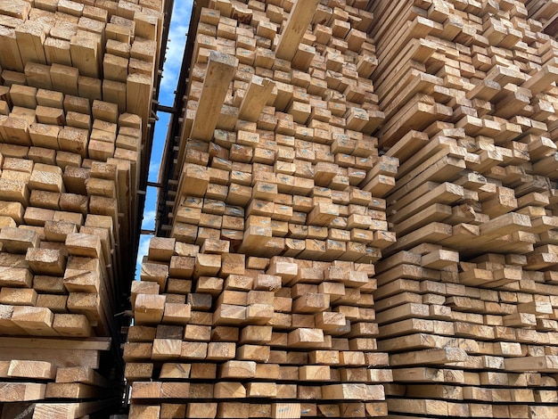 Wooden boards lumber industrial wood timber Pine wood timber stack of natural rough wooden boards on building site Industrial timber building materials