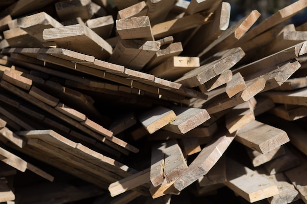 Wooden boards for repairing building are stacked outdoor