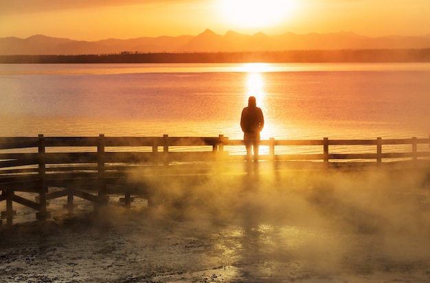 Wooden boardwalk along geyser fields  in Yellowstone National Park, USA