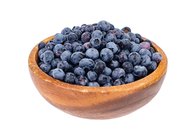 Wooden bowl with blue berry blueberry isolated.