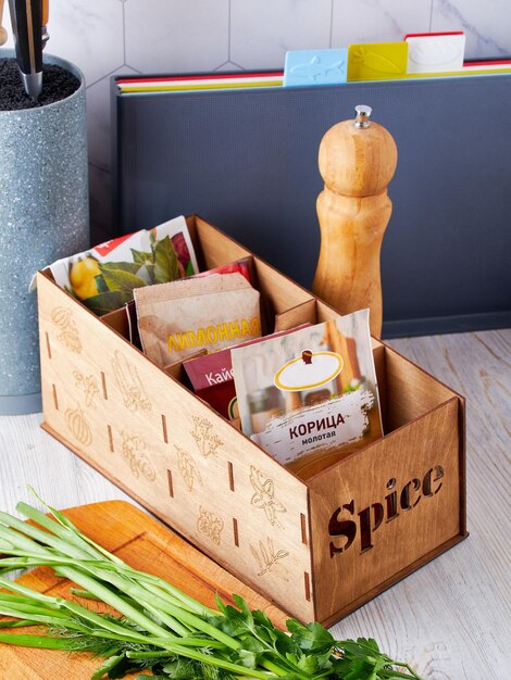 Wooden box for spices convenient storage at home order in the house order in the kitchen concept