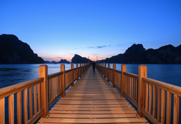 a wooden bridge with a boat on it and a mountain in the background