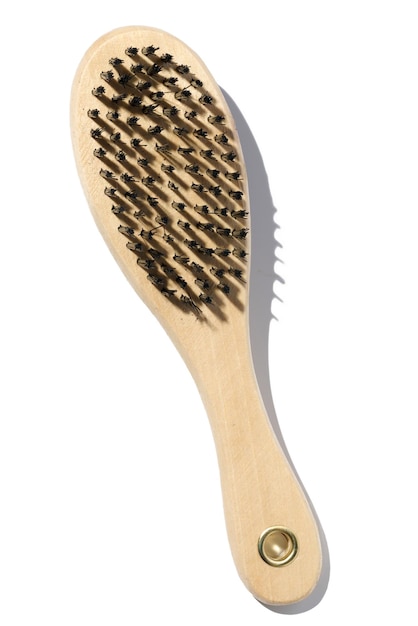 Wooden brush for animals on a white isolated background