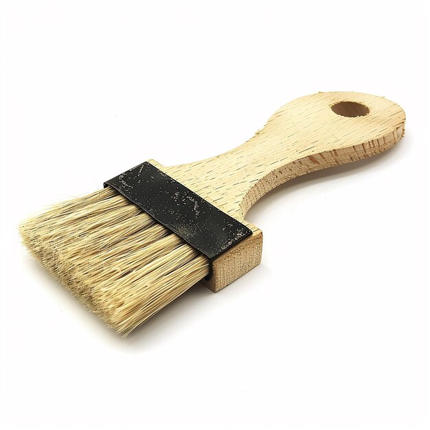 a wooden brush with a black strap that says  brush  on it